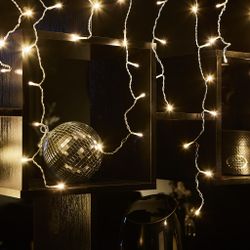 ULD-B6007-200-STK WARM WHITE IP44 Бахрома светодиодная со статическим свечением. 6м. Соединяемая. 200 светодиодов. Теплый белый свет. Провод прозрачный. ТМ Uniel