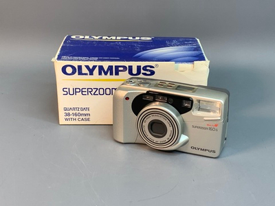 Olympus superzoom 160 G, залипает зум, ошибка