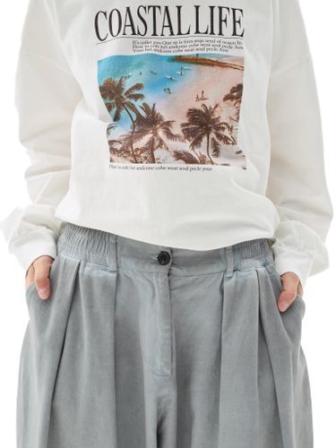 Серые хлопковые брюки-бананы с защипами