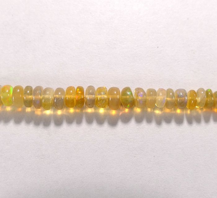 Бусина из опала благородного желтого, фигурная, 1x4 - 2x5 мм (рондель, гладкая)