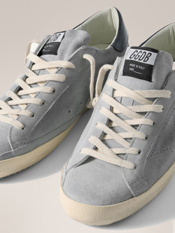 Men's Super Strar in light blue suede with a blue insert on the heel and a perforated star