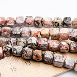 Риолит бусины, куб с огранкой, размер около 6,6-6,8 мм, цена за 13-14 шт (1/4 нити)