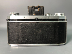 Praktica + Biometar 5,8cm 1:2, зеркало исцарапано, присутствуют пузырьки воздуха.