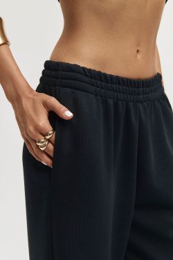 Широкие джоггеры без начеса с утяжкой черного цвета