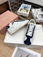 Женские кеды Miu Miu в черно-белом цвете с логотипом