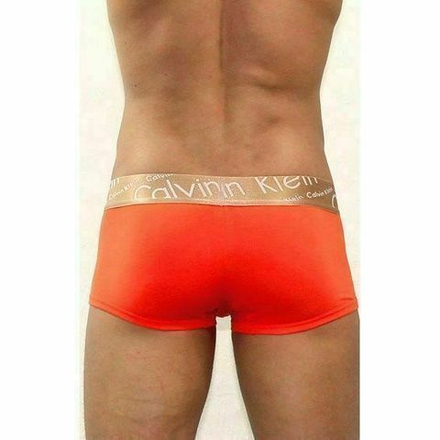 Мужские трусы хипсы рыжие с золотистой резинкой белыми буквами Calvin Klein Bronze Boxer Italics