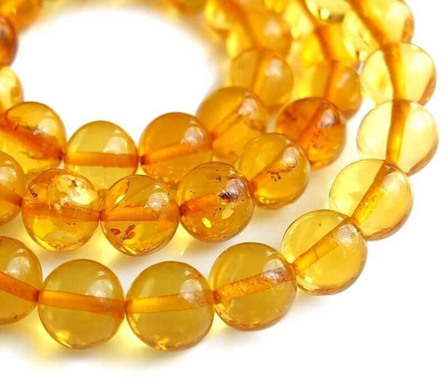 Элегантные бусы из прозрачных янтарных шаров