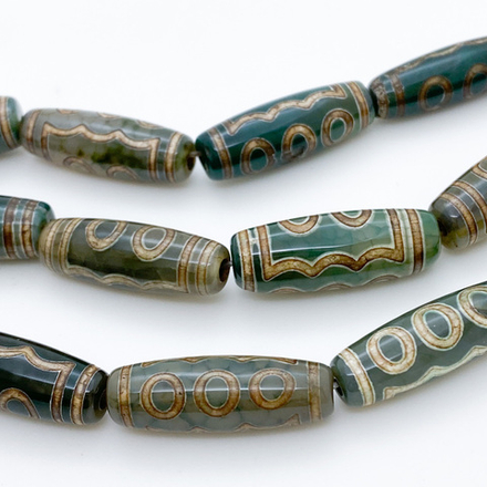 "Дзи" 5 Глаз, размер около 30*10 мм, цена за 1 шт