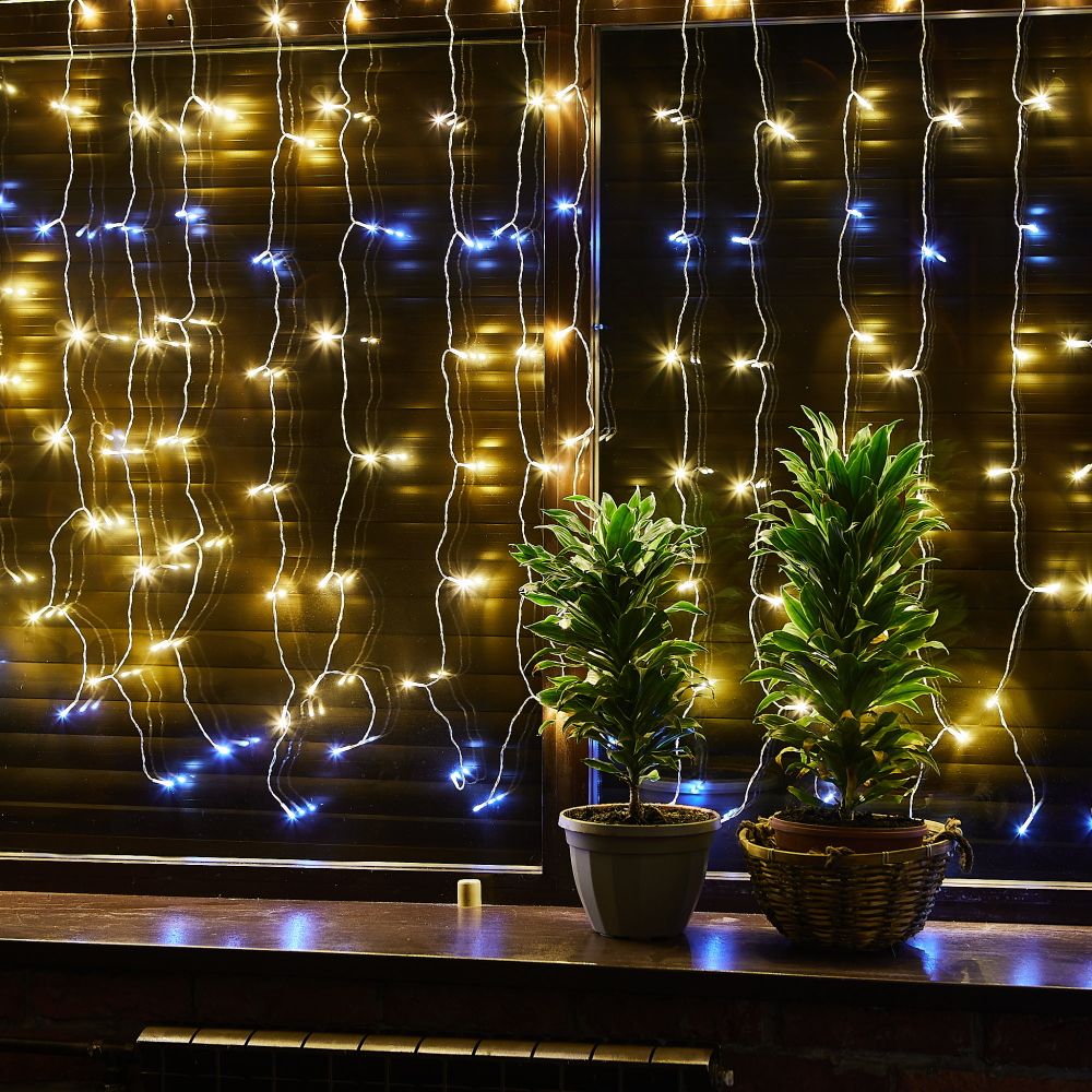 ULD-C2030-240-TTK WARMWHITE-WHITE IP44 Занавес светодиодный с эффектом мерцания. 3х2м. Соединяемый. 240 светодиодов. Теплый белый и белый свет. Провод прозрачный. TM Uniel.