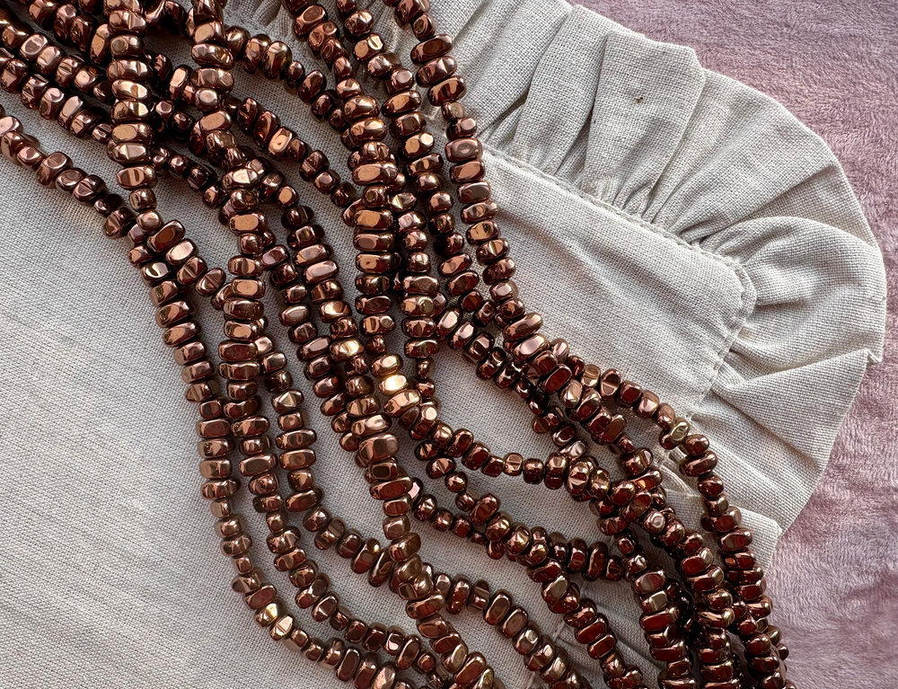 Нить гематитовых бусин, 7-9мм, галтовка