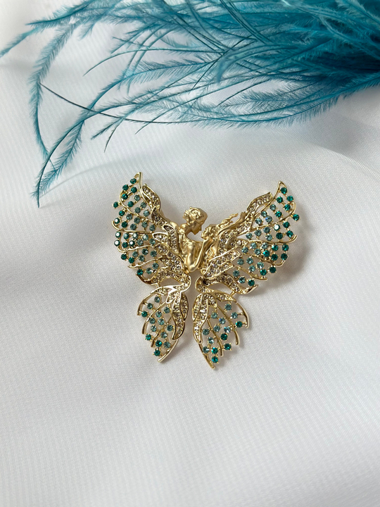 Брошь бабочка с голубыми кристаллами, женский и мужской профили, оттенок золото