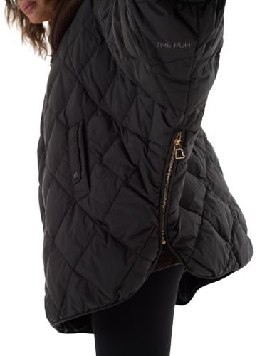 Черный пуховик-летучая мышь с вязаным капюшоном