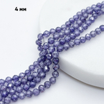 Фианит (кубический цирконий), цвет фиолетовый, размер 4 мм, цена за отрезок 19 см (1/2 нити)