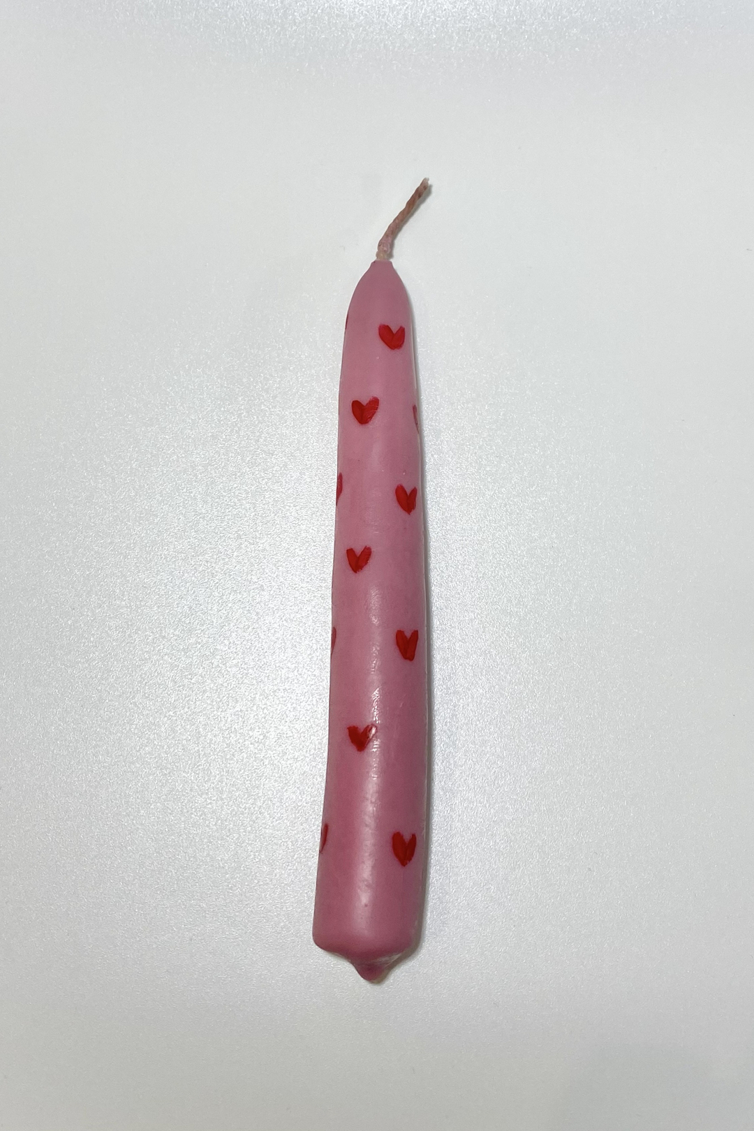 Розовая свеча с сердечками