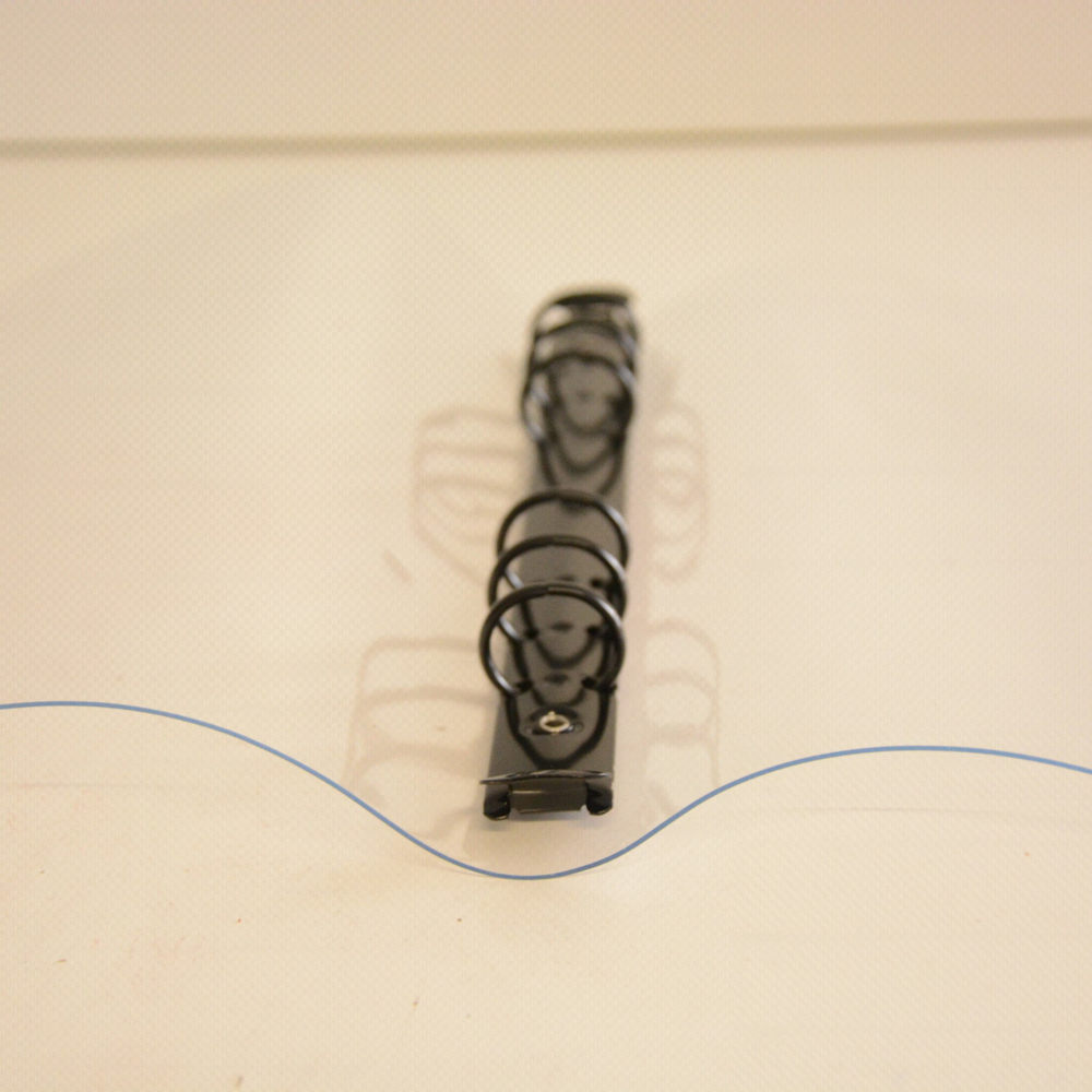 Обложка силиконовая (ПВХ) прозрачная с зеленым хлястиком из кожзама и черным кольцевым механизмом, формат А5-II