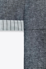 Linen blazer with rolled-up sleeves