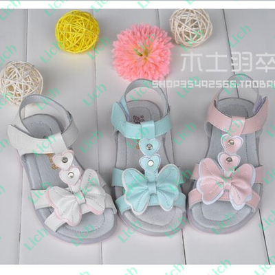 Босоножки однотонные с декоративными бантами