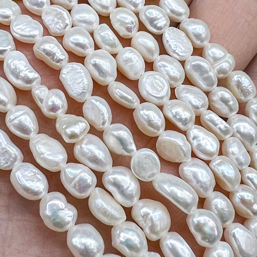 Жемчуг 2А речной бусины 5-6 мм, на нитке 38 см