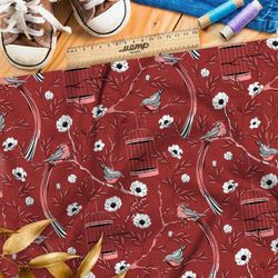 Ткань флис мелкие снегири, цветы и птичьи клетки на бордовом фоне