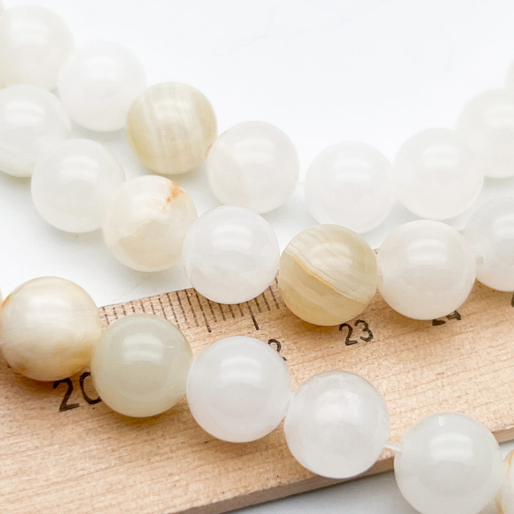 Кальцит бусины, диаметр около 10,3-10,5 мм, цена за 18 шт (1/2 нити)