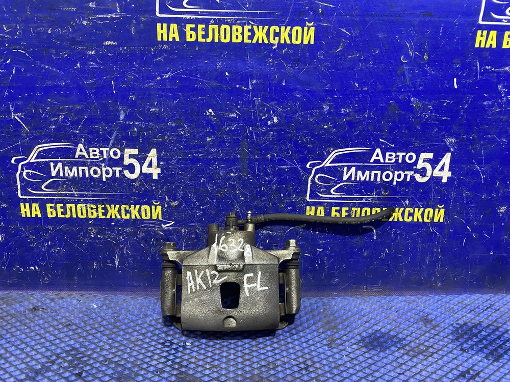 Суппорт тормозной передний левый NISSAN MARCH 2002-2010