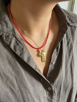 MANIOVICH Red Beads Necklace with Hand Pendant