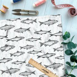 Ткань штапель рыбы на бежевом фоне