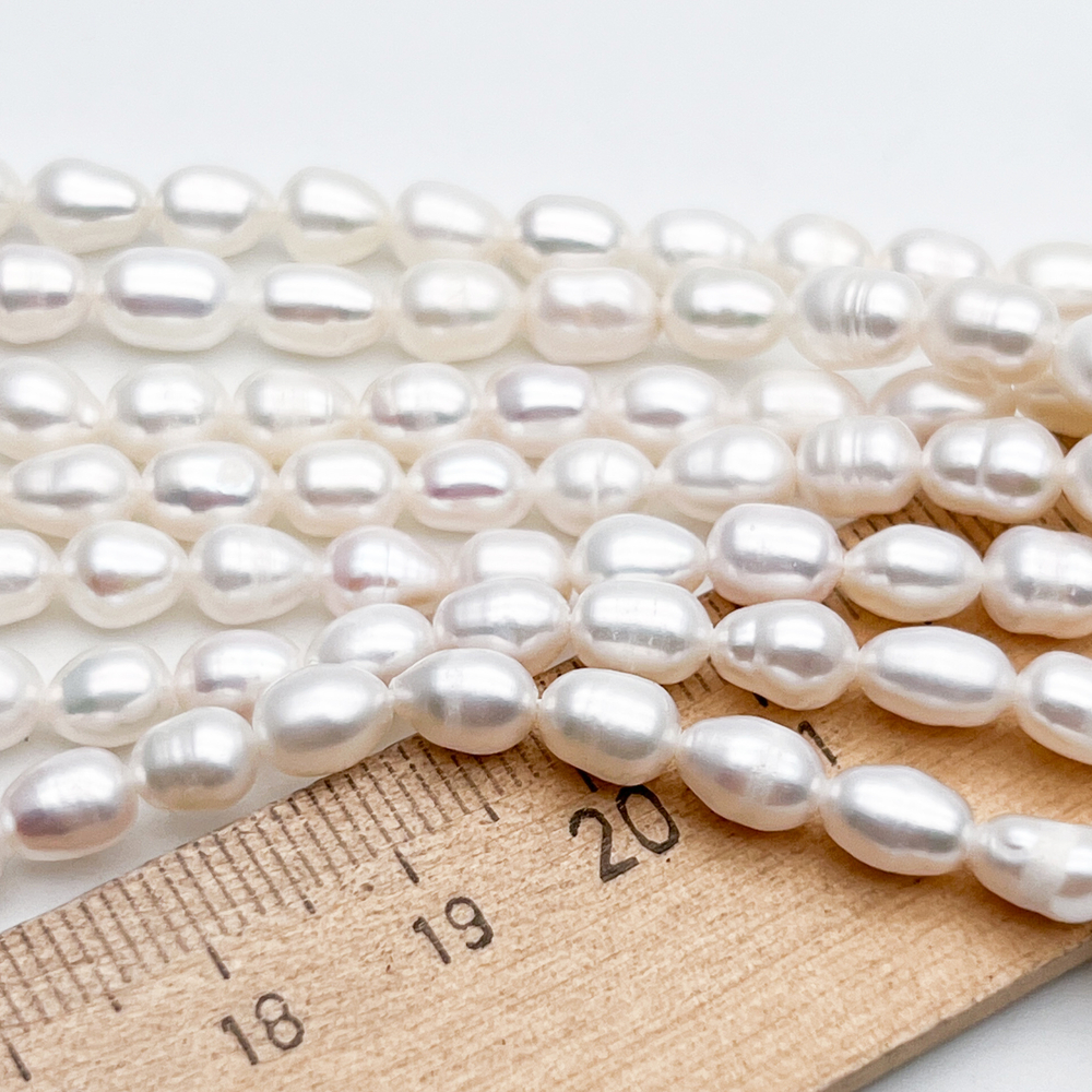 Жемчуг Рис бусины, размер около 6-7,5*5-5,5 мм, цена за отрезок 17 см (1/2 нити)