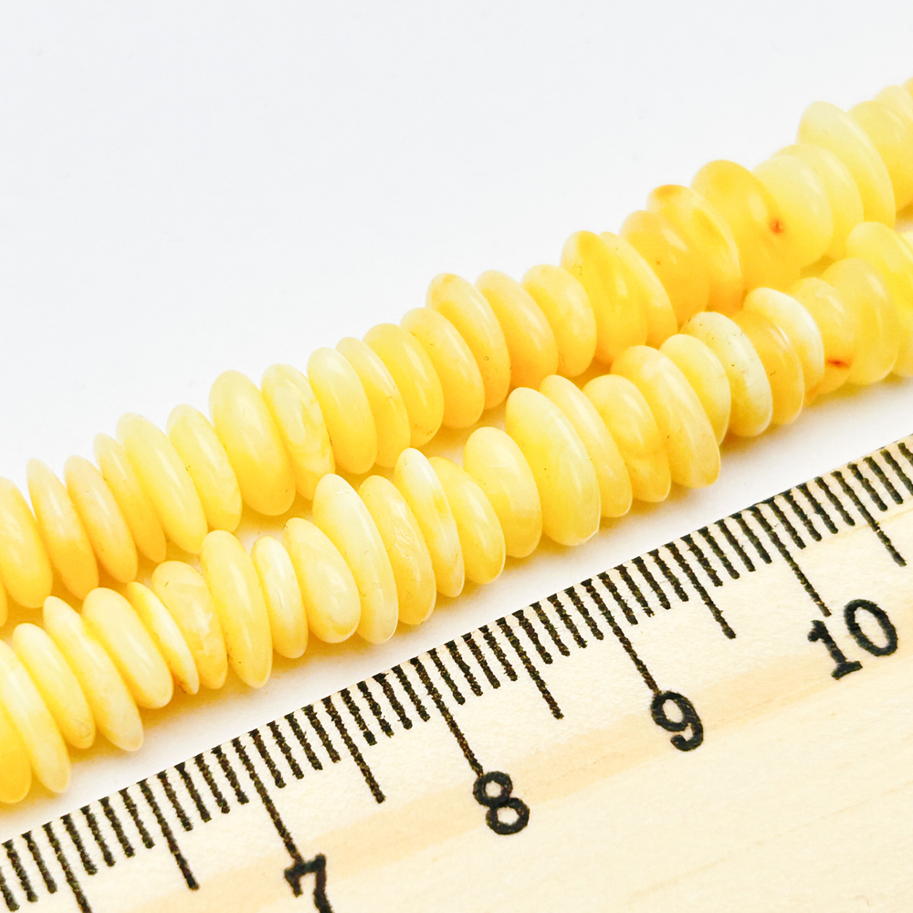 Янтарь бусины, размер 5,8-7,4*1,4-2, мм, цена за отрезок 9 см (1/4 нити)