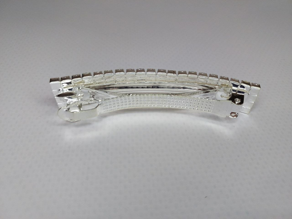 Французская весенняя заколка автомат для волос. Со стразами в четыре ряда. Цвет серебро.