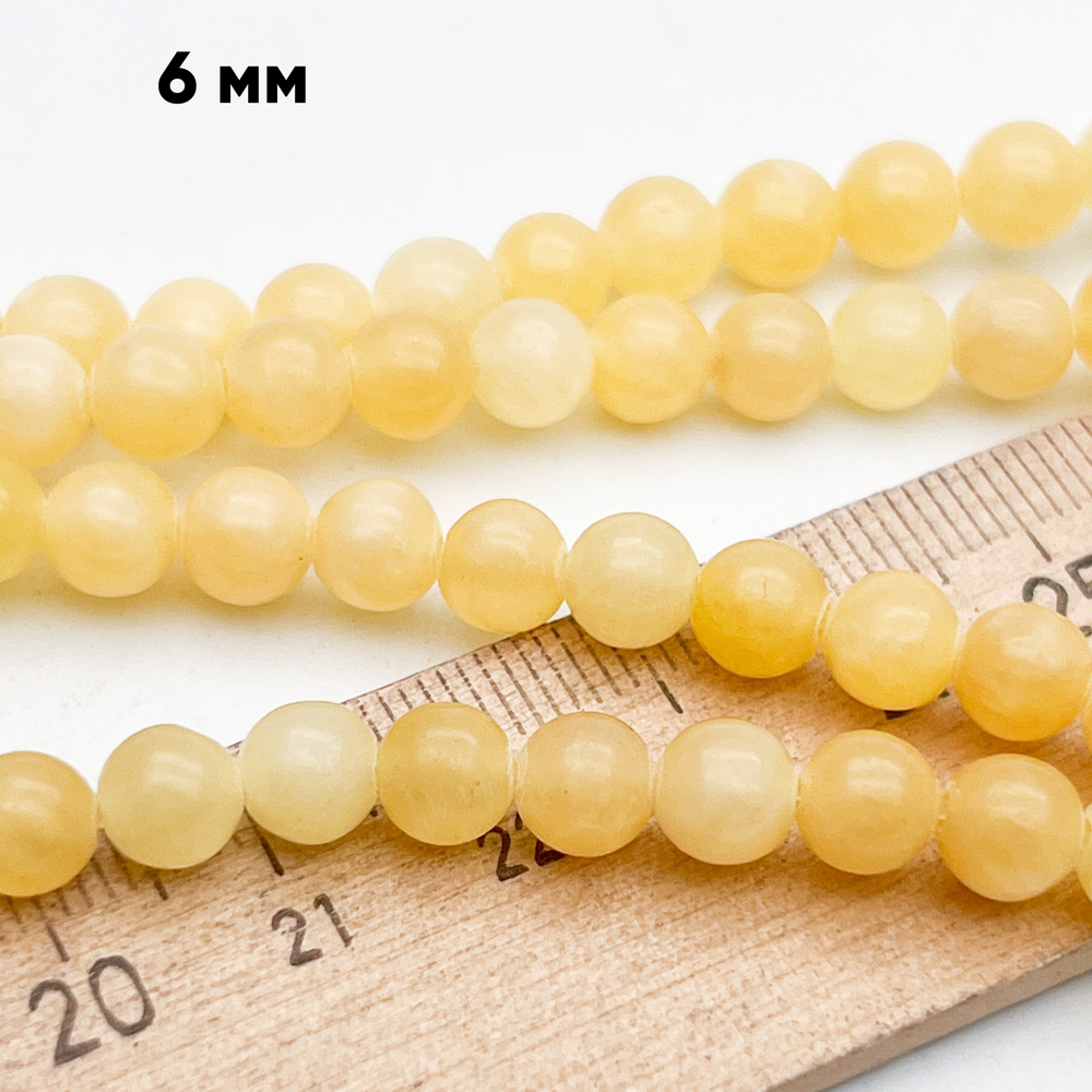 Кальцит желтый бусины, диаметр около 6,2 мм, цена за 29-30 шт (1/2 нити)