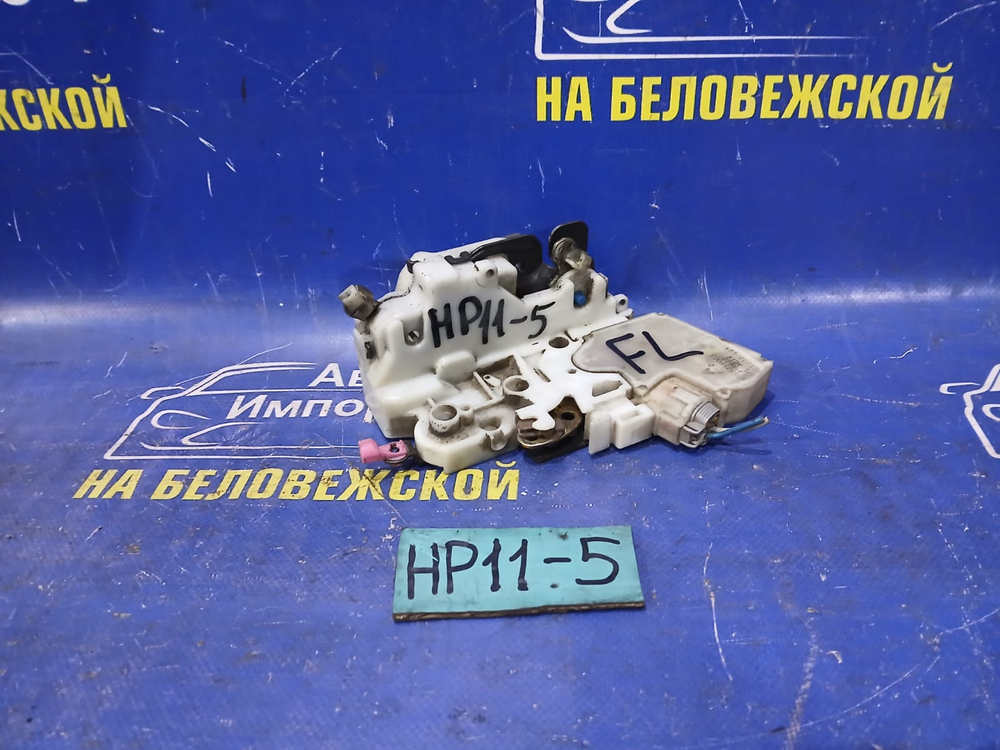 Замок двери передней левой NISSAN PRIMERA 1998