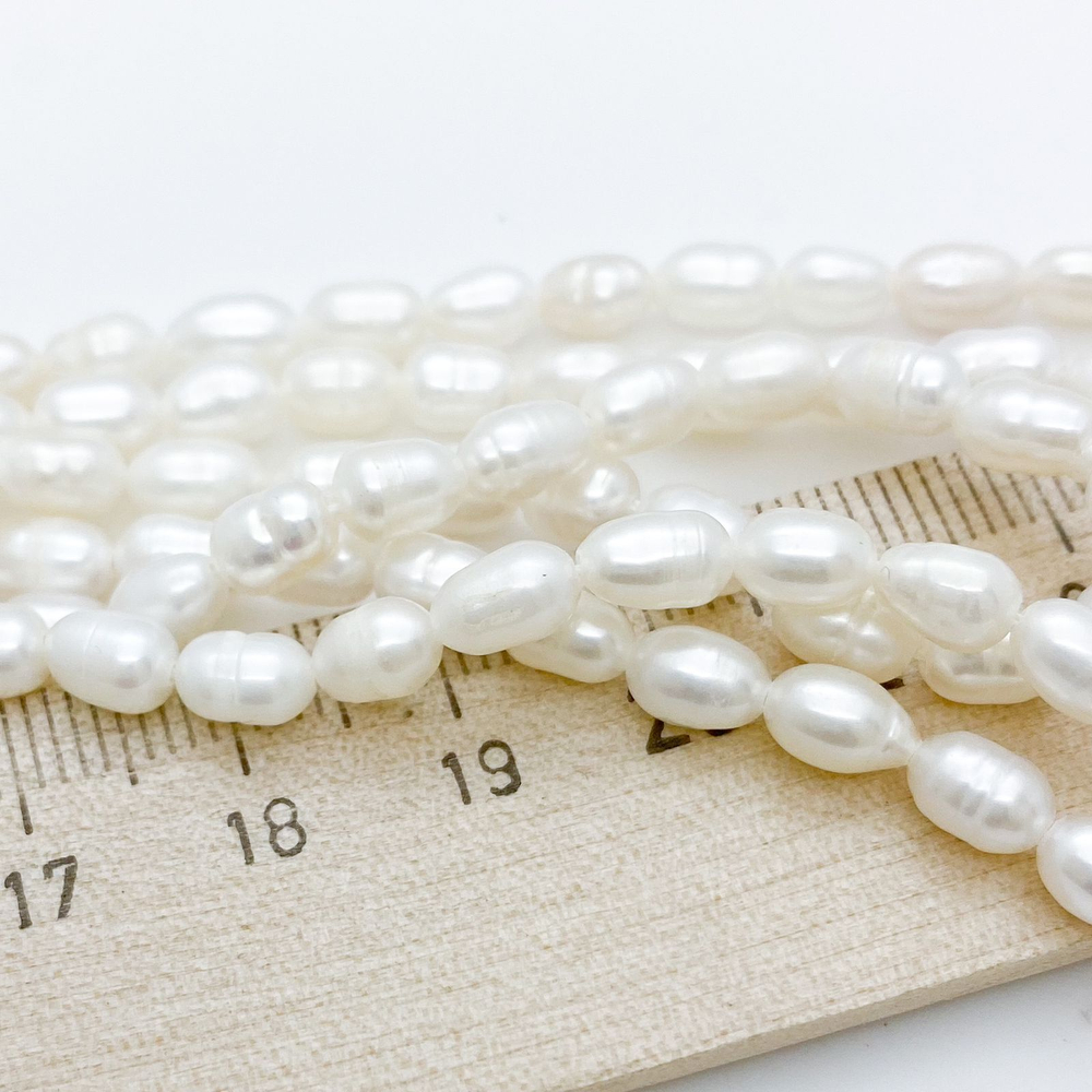 Жемчуг, размер около 6,5-7*4,5 мм, цена за 27-28 шт (1/2 нити)