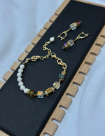 Браслет кубики из прозр.,телесн. и золот.кристал.Swarovski,гематита и жемчуга Майорки,оттенок золото