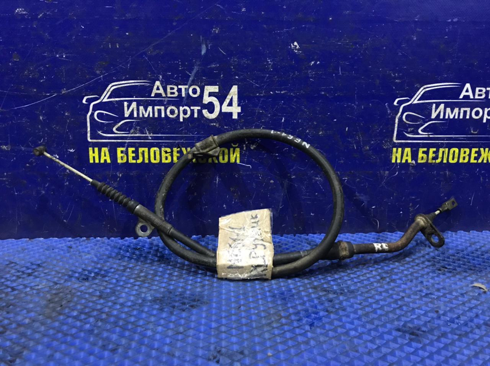 Трос ручника левый NISSAN ELGRAND 2005