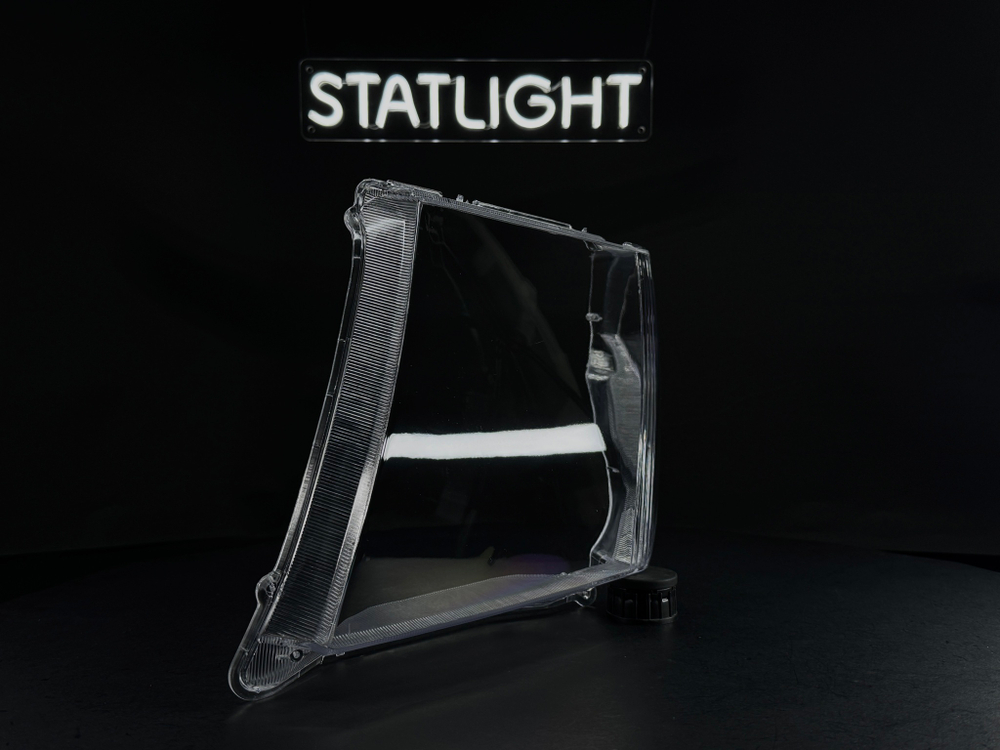 Левое стекло фары Nissan Navara Pathfinder R51 2004-2010