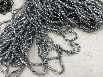 Бусины граненые Биконус стекло на леске, р. 4х4 мм, отверстие 1 мм, ~83 бусины*10 нитей, черненое серебро