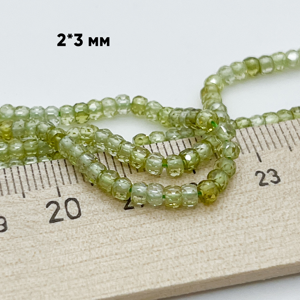 Фианит, рондель с огранкой, цвет салатовый, размер около 3,1*2,3 мм, цена за нить 38 см (около 165 шт)