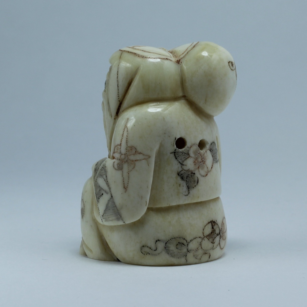 Нэцкэ Фукурокудзю с мешком на плече