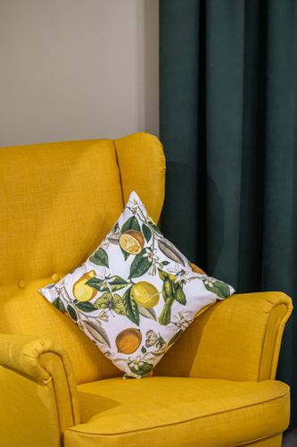 pillow-with-lemons-yellow-armchair-interior-room.jpg