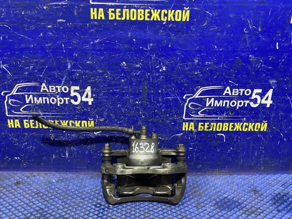 Суппорт тормозной передний левый NISSAN MARCH 2002-2010