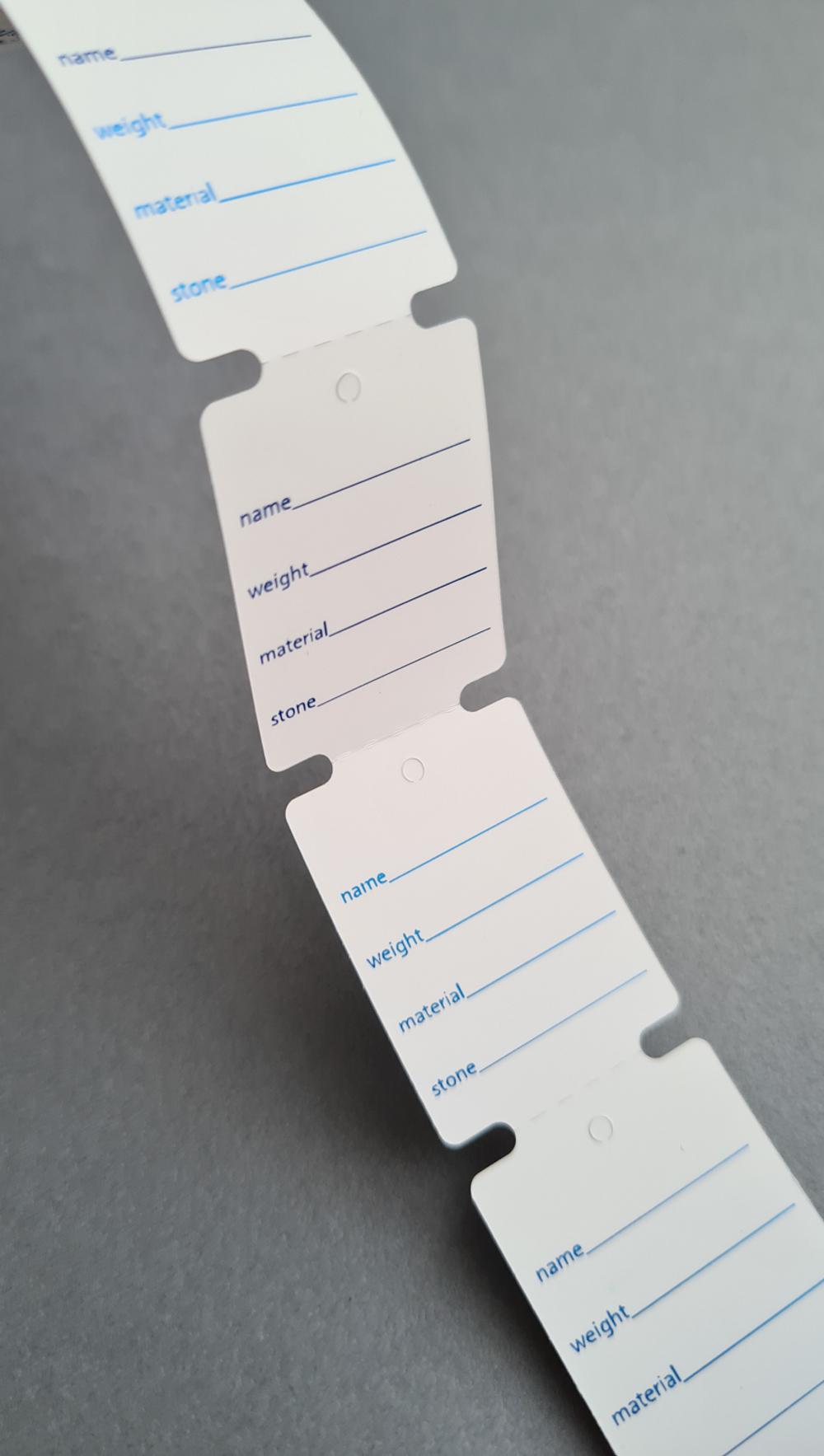 Бирки 24*33 мм. Печать синей фольгой с двух сторон. 1 рул = 1 000 шт