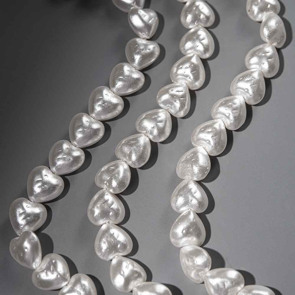 Хрустальный жемчуг в форме сердечек с бороздками, белый 12мм