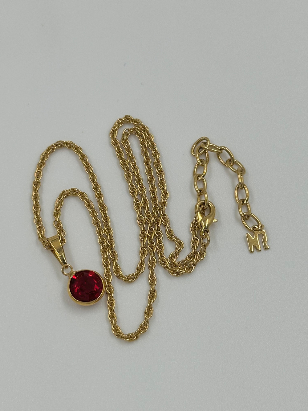 Миниатюрный кулон Nina Ricci