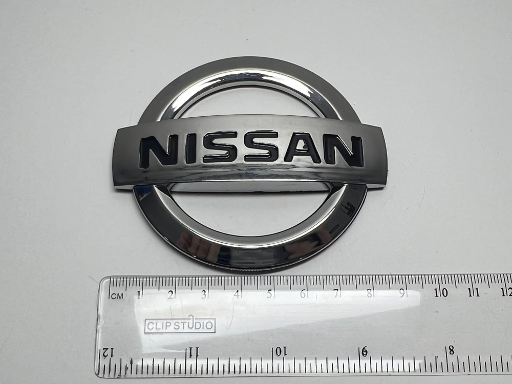 Логотип (шильдик, надпись, эмблема) "Nissan" 9см для крышки багажника / решетки радиатора / капота