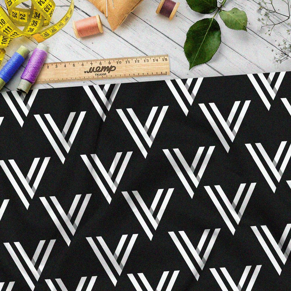 Ткань оксфорд 210 белый треугольный узор на чёрном фоне