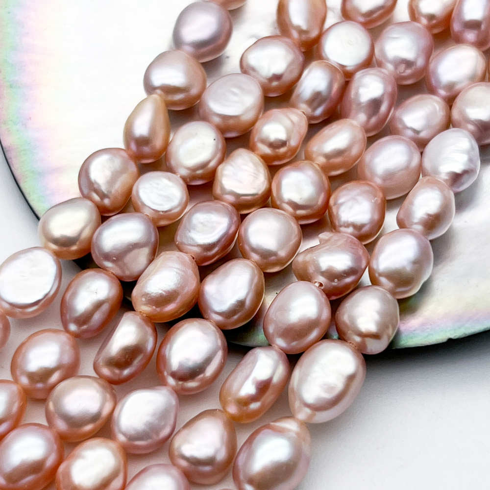 Жемчуг бусины, цвет розовый, размер около 8,8-10,2*7,3-8,2 мм, цена за 9 шт (1/4 нити)
