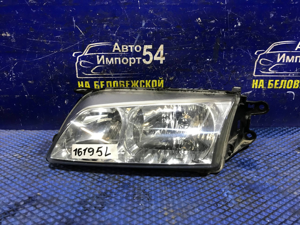 Фара передняя левая MAZDA CAPELLA 1999-2002