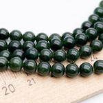 Нефрит бусины, диаметр около 5,9-6 мм, цена за 16 шт (1/4 нити)