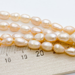 Жемчуг (сорт Б), цвет персиковый, размер около 7-8*6-6,5 мм, цена за нить 34 см (около 42 шт)